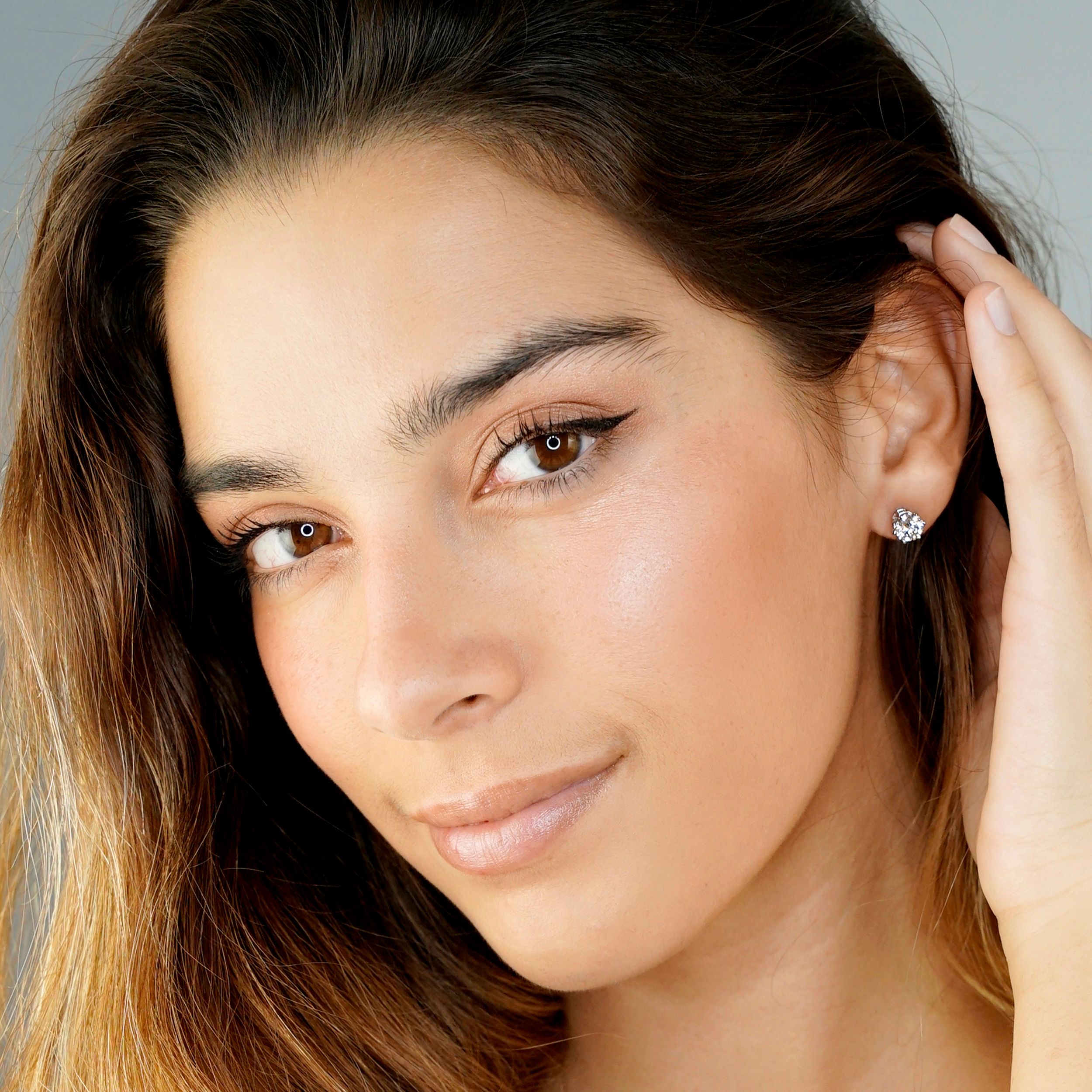 up close, woman's face, diamond earrings